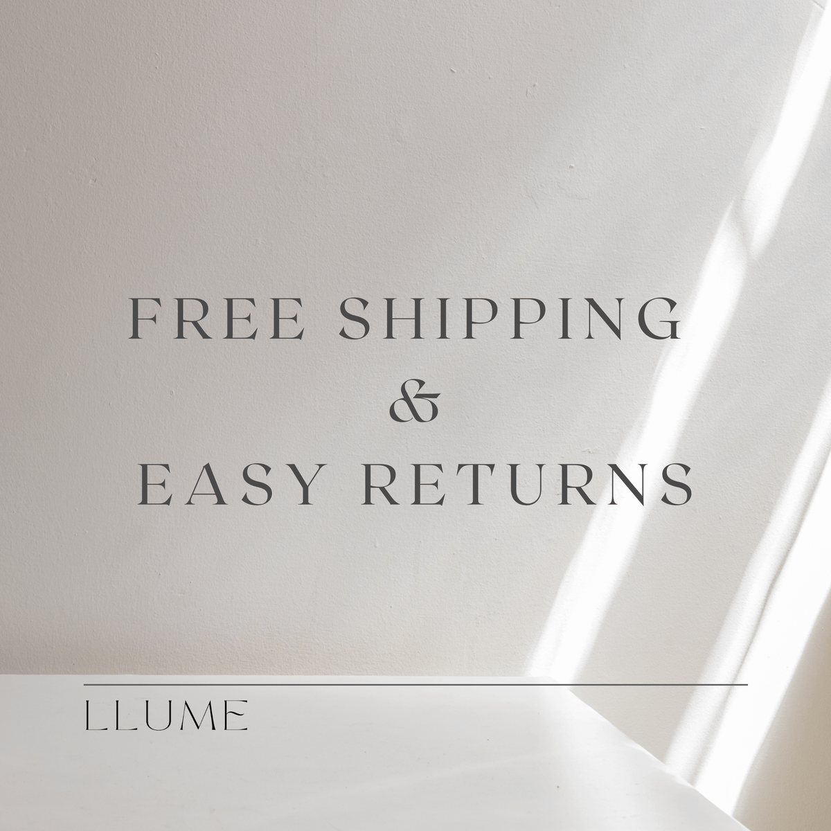 Text on a light background reads: “FREE SHIPPING & EASY RETURNS.” “LLUME Jewelry” appears at the bottom with a line above it. Sunlight casts soft diagonal shadows, evoking the elegant glow of the Golden Hour Chain necklace.