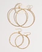 Gold bohemian hoop earrings both sizes displayed together on surface
