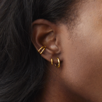 Gold Ethereal Huggies styled on ear