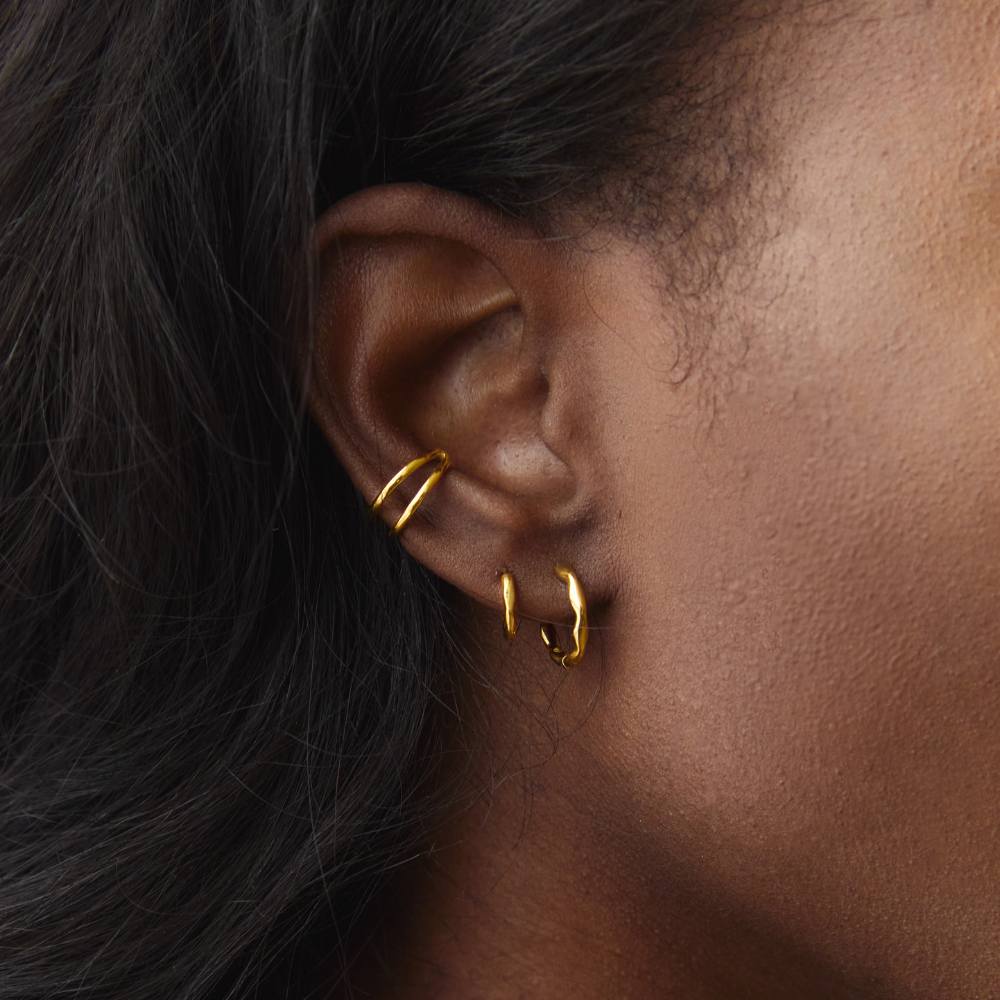 Gold Ethereal Huggies styled on ear