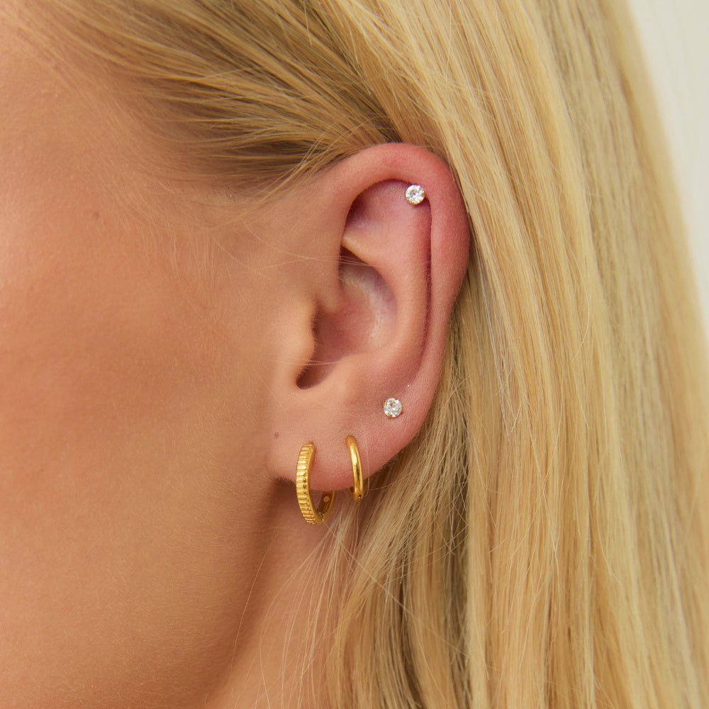 Gold Pleated Huggies styled on ear