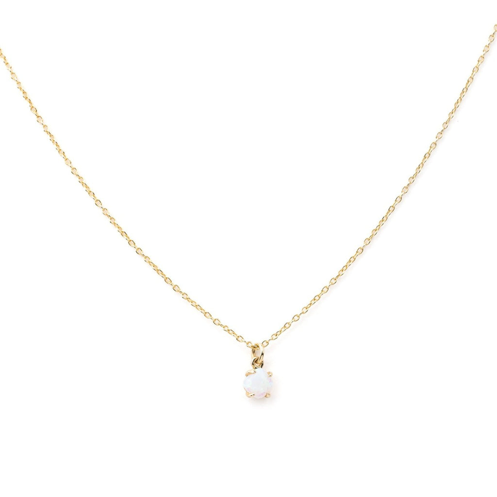 The LLUME Jewelry Sardinia Opal Necklace features a delicate gold vermeil chain with a small, round white opal pendant in a simple gold setting, displayed against a plain white background.