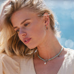 Silver Ultimate Midi Hoops 20mm worn in summer lifestyle setting