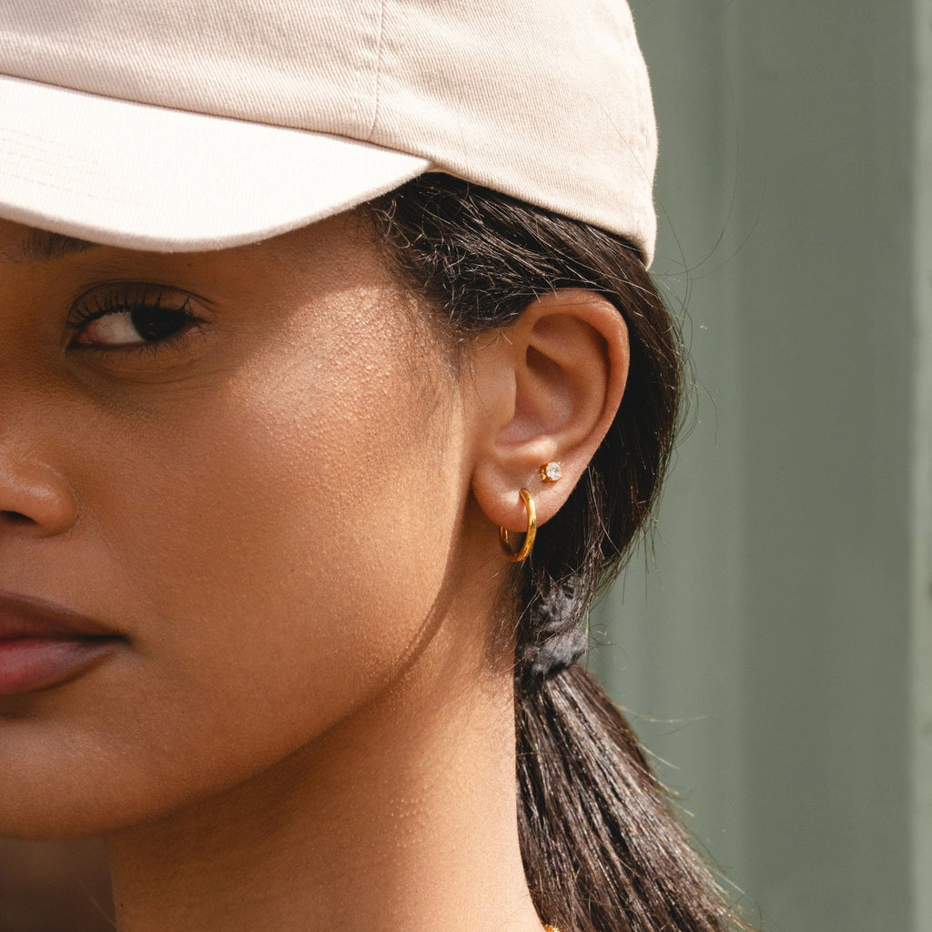 Silver Ultimate Mini Hoops 12mm worn in lifestyle setting