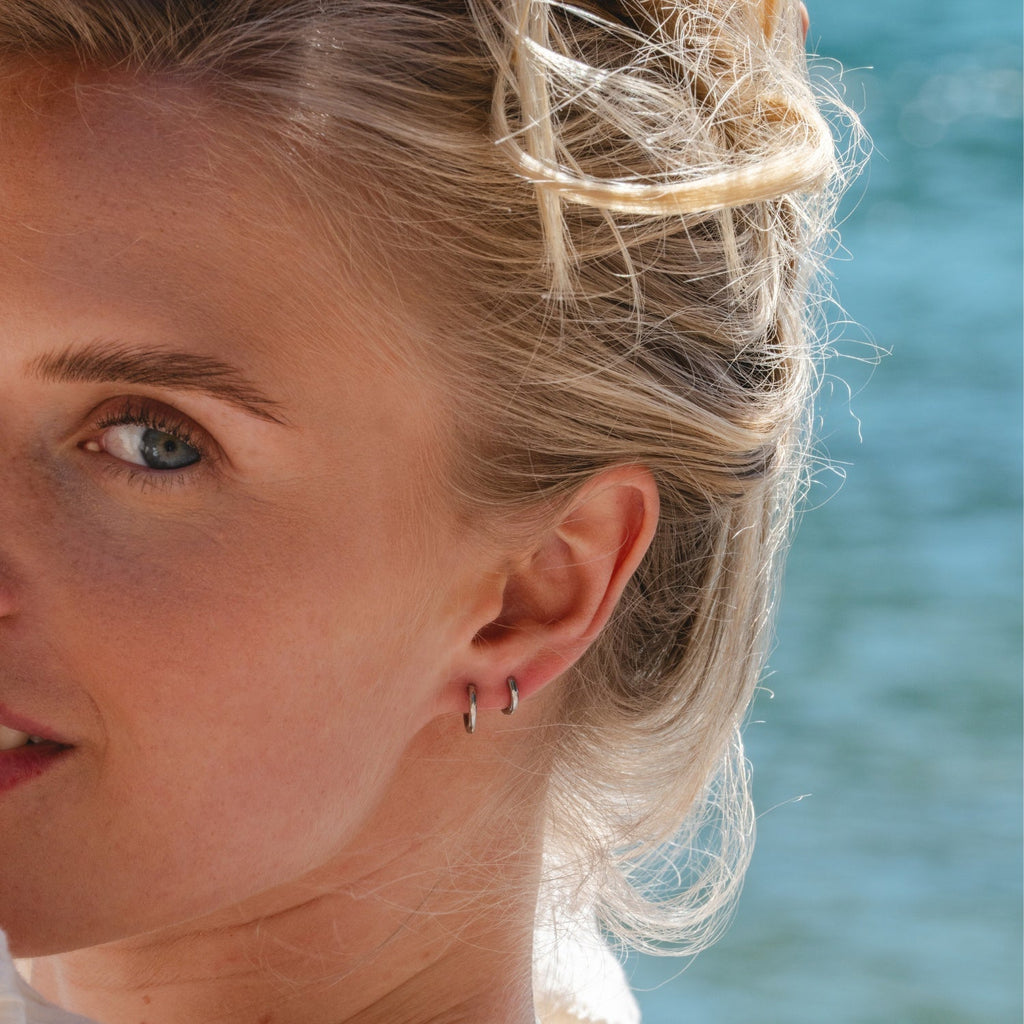 Silver Ultimate Huggies 8mm worn in lifestyle setting