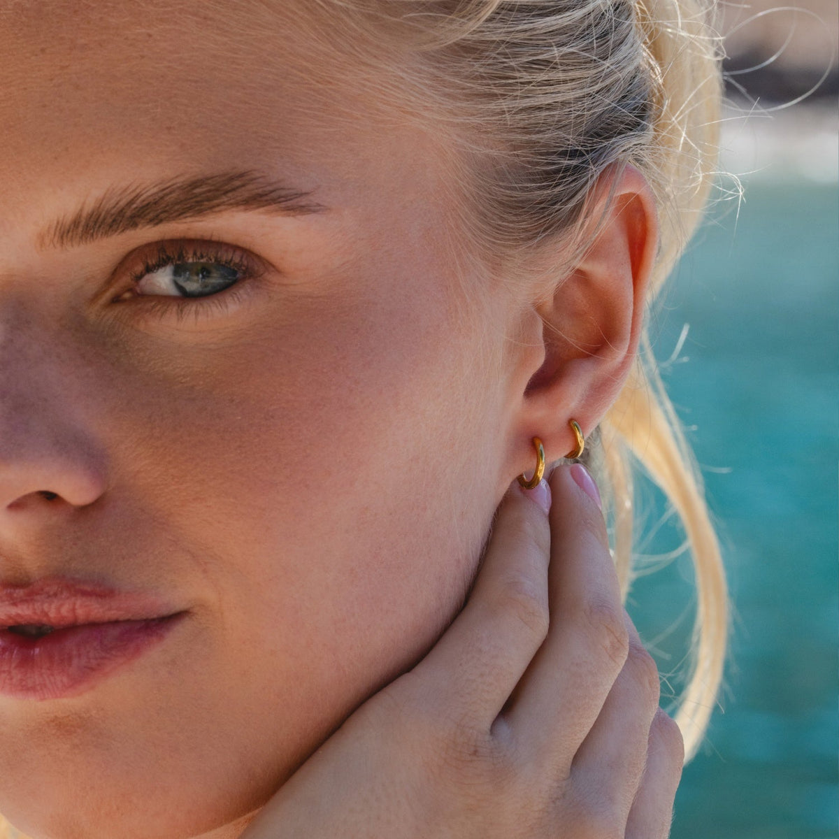 Gold Ultimate Huggies 8mm worn in summer outdoor lifestyle setting