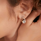 Earrings with golden cross and zirconia