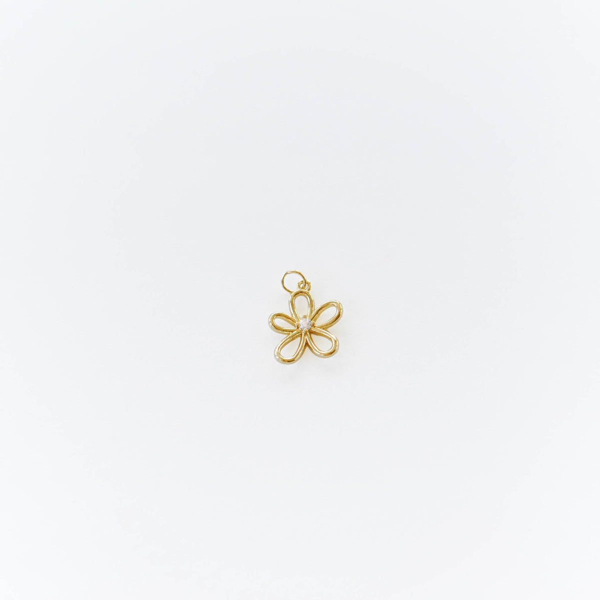 A delicate gold-filled five-petal flower pendant from LLUME Jewelry is showcased on a white background, perfect for adding to your Build a Charm Necklace.