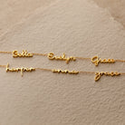 Three gold Dainty Tiny Multiple Name Necklaces display the names Bella, Evelyn, Grace, Harper, Anna, and Grace on beige paper—a perfect personalized accessory for lovers of dainty necklace styles.