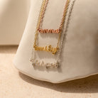 Three Tiny Dream Name Necklaces featuring the names hannah, emily, and harper in gold, rose gold, and silver, each crafted in delicate cursive for a personalized touch.