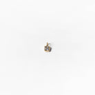 The Build a Birthstone Necklace by LLUME Jewelry features a small gold square pendant with a light gemstone, shown against a plain white background.